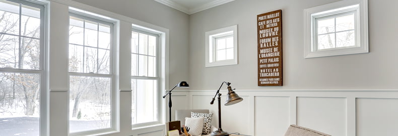 casement windows with white grille detail in neat living room