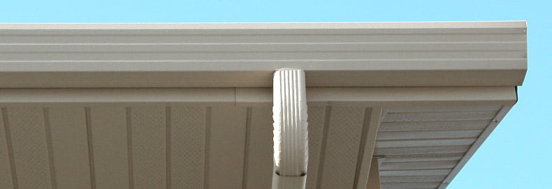 SoffitandFascia_790x271 close up of downspout, soffit, and fascia
