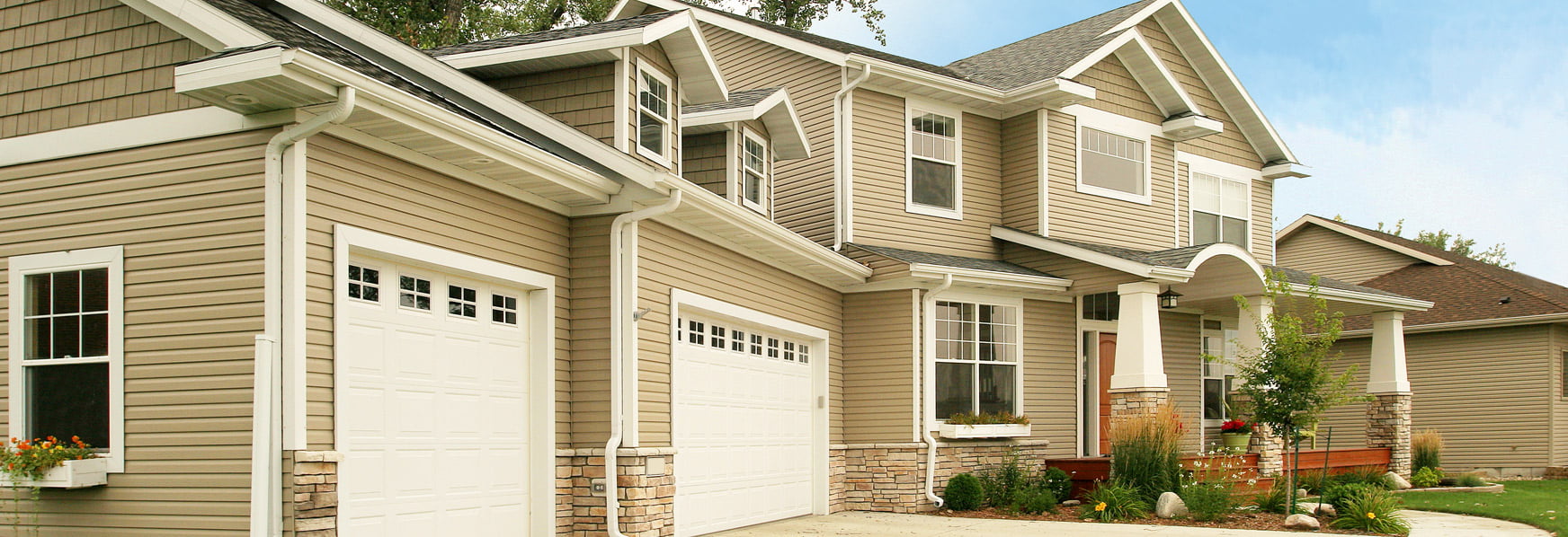Jamestown home featuring tan stainless steel siding