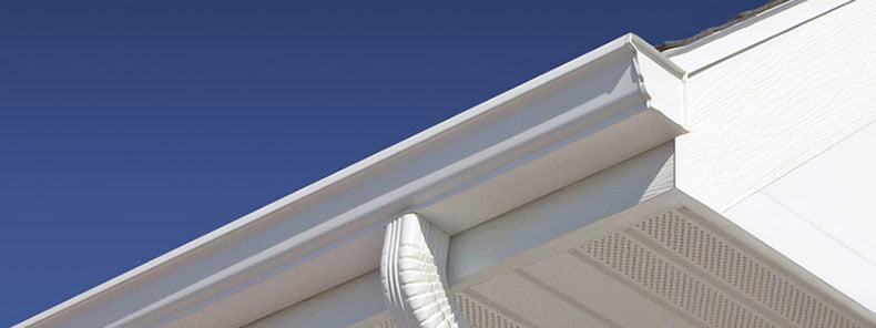 soffit_fasia_gutters low angle shot of white gutter on white house