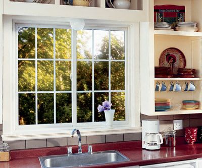 home interior kitchen two gliding / sliding windows with decorative grilles above sink