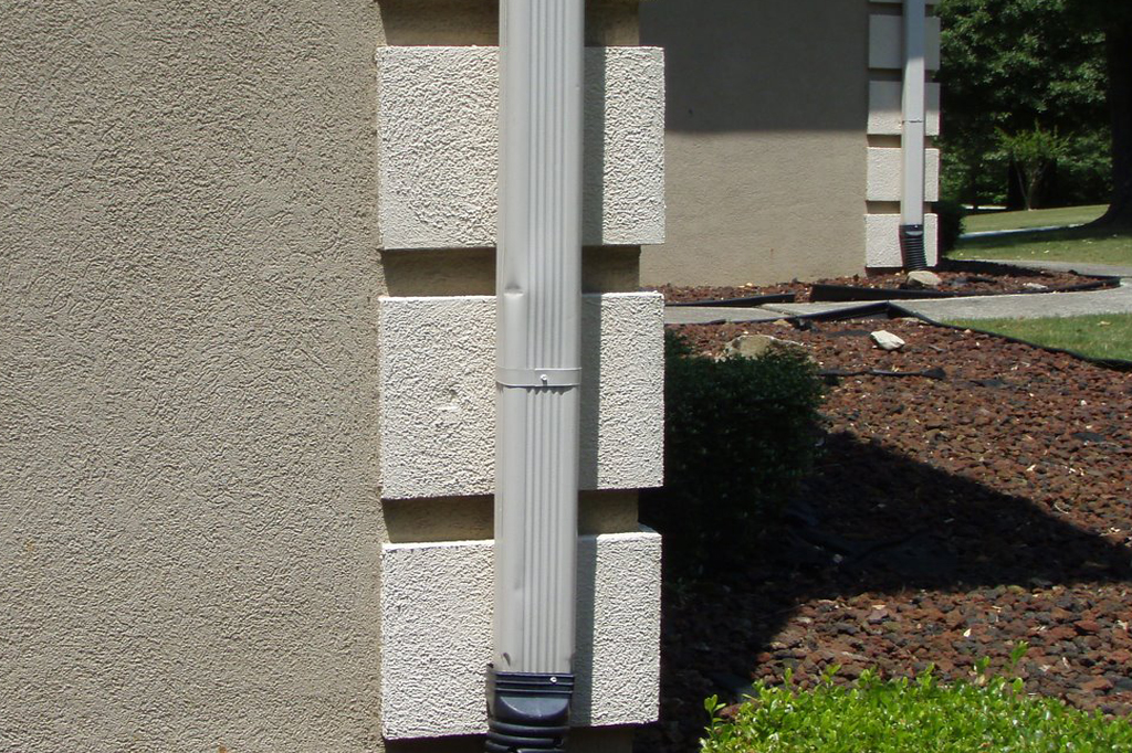 Home exterior in disrepair to roof, gutter, chimney, siding.